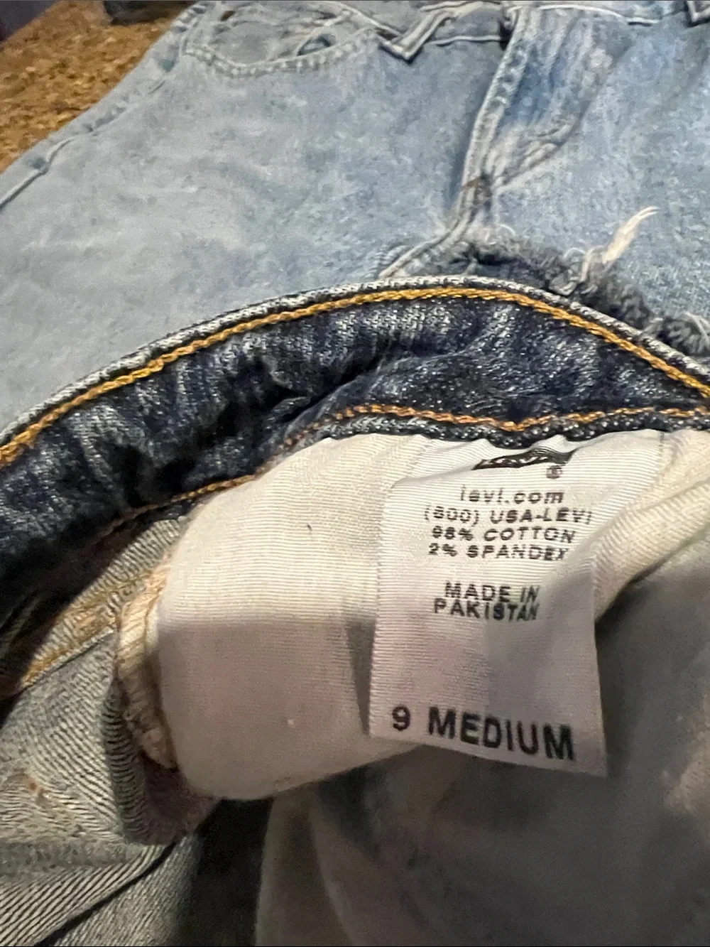 Levi's light blue denim shorts with frayed hem